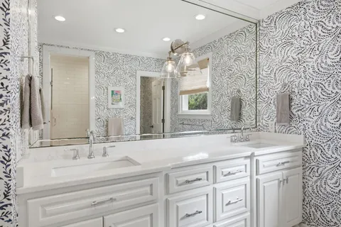 a bathroom with a sink a toilet and shower curtain