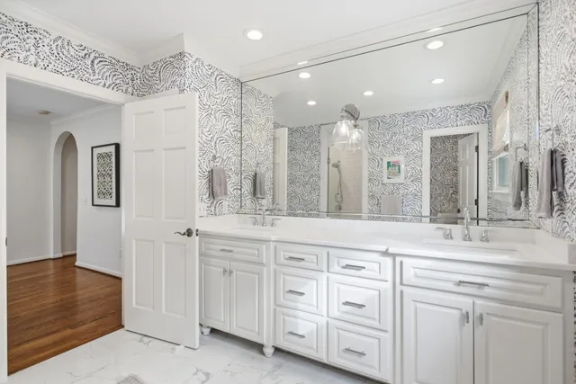 a bathroom with a sink a mirror and a toilet