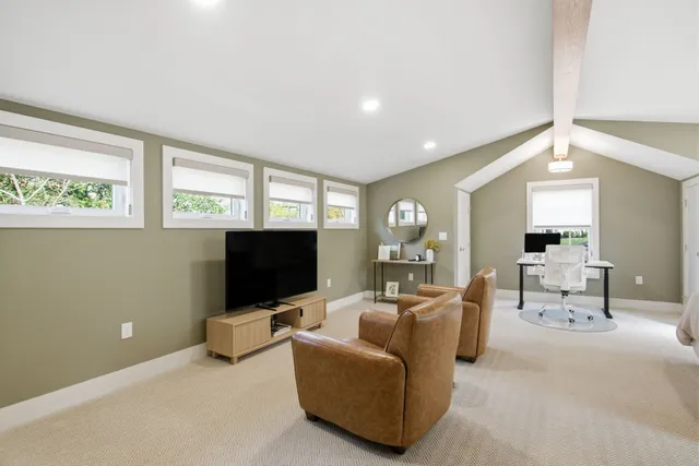 a room with furniture and a flat screen tv