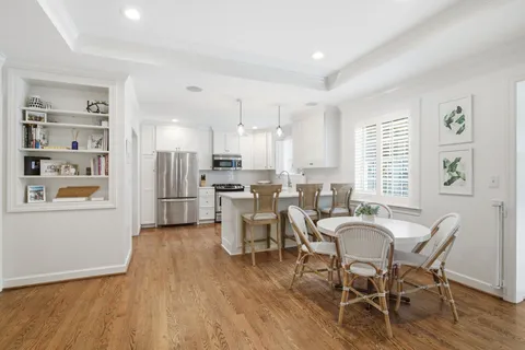 a kitchen with cabinets stainless steel appliances a sink a stove and cabinets