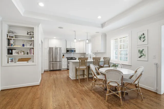 a kitchen with cabinets stainless steel appliances a sink a stove and cabinets