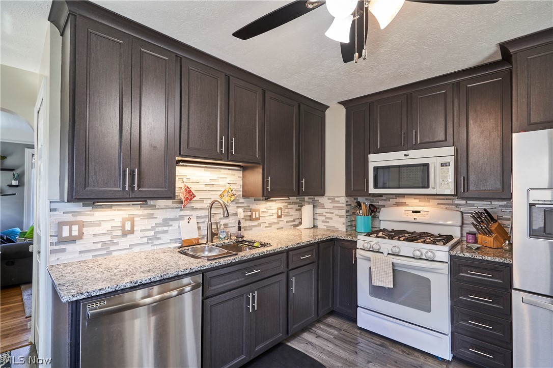 28322 Forest Road Willowick, OH 44095 - Photo 10 of 32 Kitchen featuring appliances with laminate style floors, sink, and ceiling fan