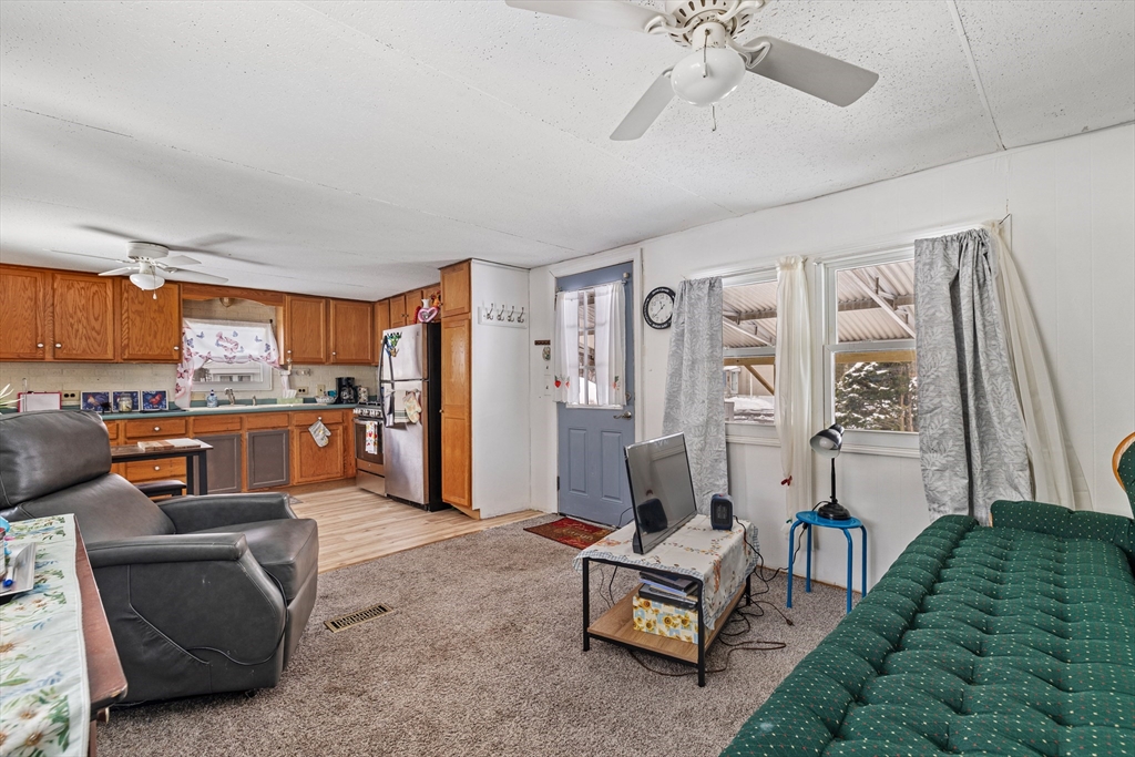 365 Main Street, Unit 3 Sturbridge, MA 01566 - Photo 11 of 20 a living room with furniture kitchen view and a window