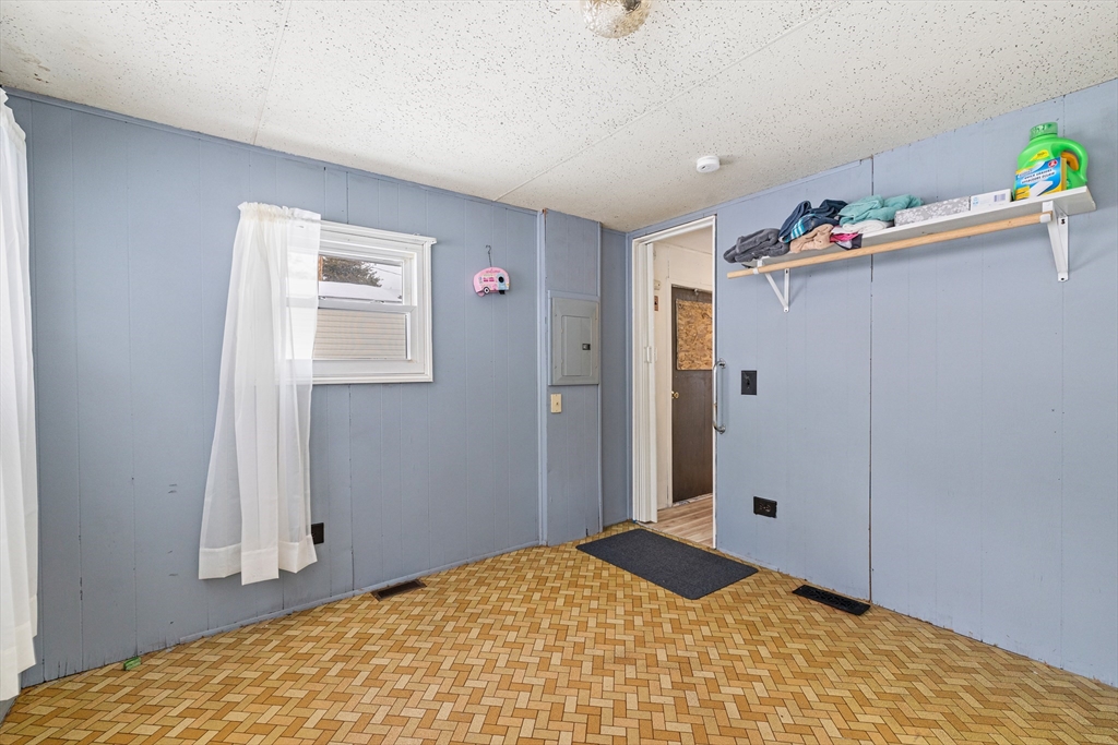 365 Main Street, Unit 3 Sturbridge, MA 01566 - Photo 15 of 20 a bedroom with a bed and a cabinets