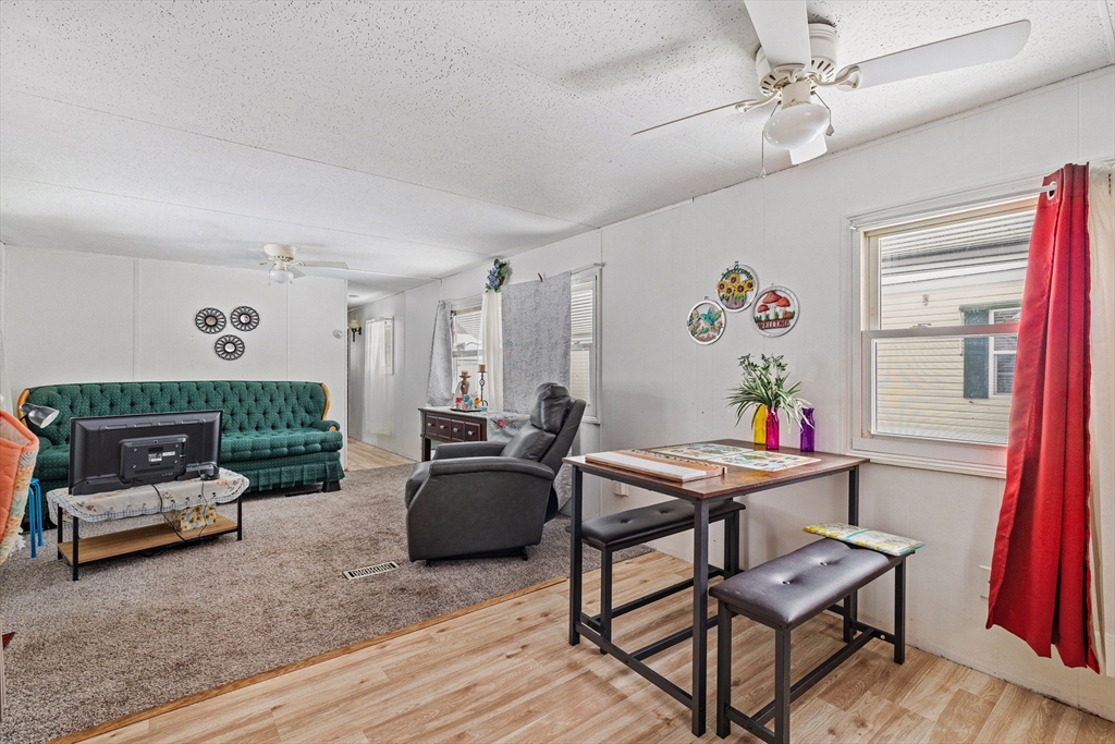 365 Main Street, Unit 3 Sturbridge, MA 01566 - Photo 9 of 20 a living room with furniture and a wooden floor