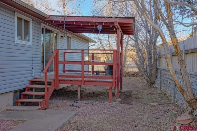 a view of a backyard with sitting area