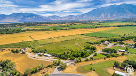 19 East Southfield Road Spanish Fork, UT 84660 - Photo 5 of 74 Aerial view of sparsely populated area with a mountain backdrop