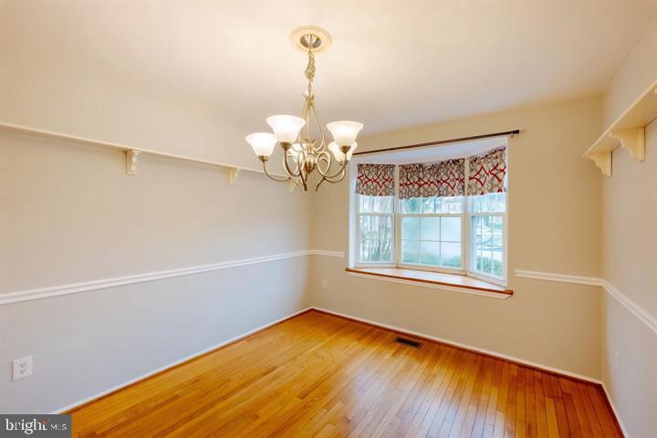 30 Wellspring Circle Owings Mills, MD 21117 - Photo 8 of 19 a view of a room with wooden floor fan and window