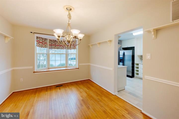 30 Wellspring Circle Owings Mills, MD 21117 - Photo 9 of 19 a view of a room with window and wooden floor