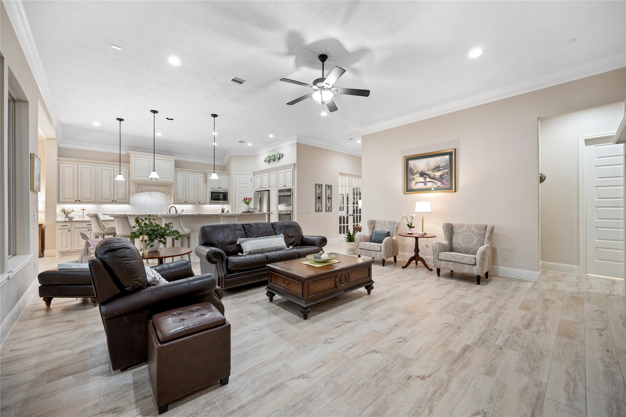 19911 Cullen Ridge Drive Porter, TX 77365 - Photo 12 of 42 a living room with furniture and a chandelier