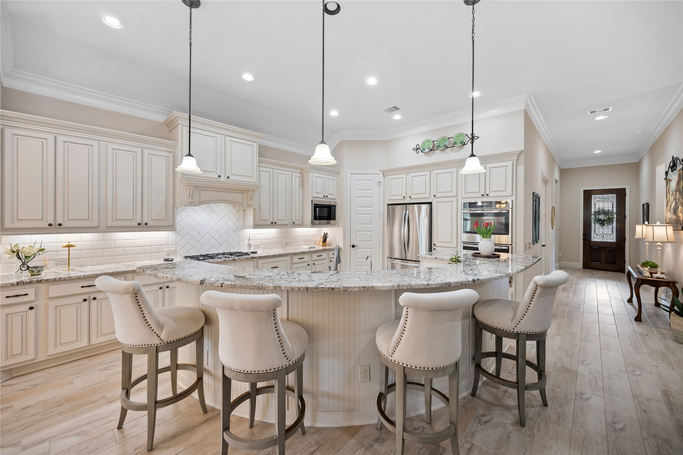 19911 Cullen Ridge Drive Porter, TX 77365 - Photo 13 of 42 a large kitchen with a table and chairs