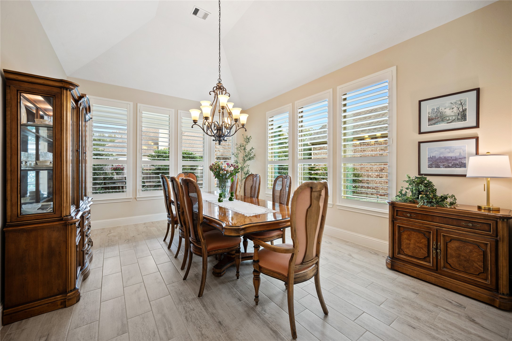 19911 Cullen Ridge Drive Porter, TX 77365 - Photo 18 of 42 a dining room with furniture a chandelier and wooden floor