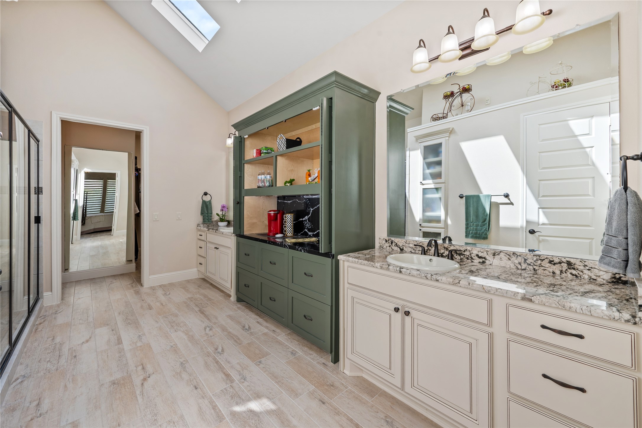 19911 Cullen Ridge Drive Porter, TX 77365 - Photo 23 of 42 a spacious bathroom with a sink mirror and vanity