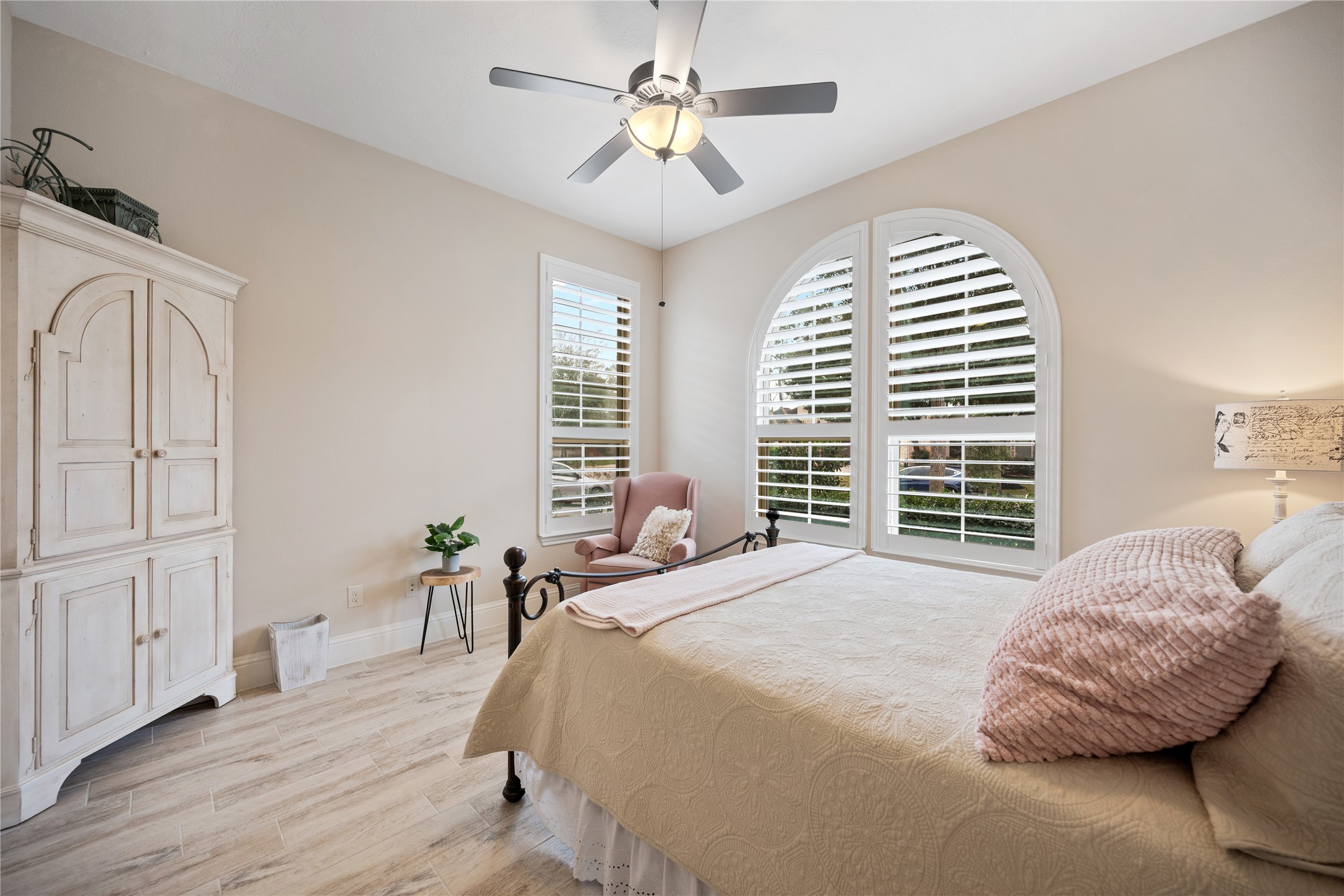 19911 Cullen Ridge Drive Porter, TX 77365 - Photo 28 of 42 a bedroom with a bed and wooden floor