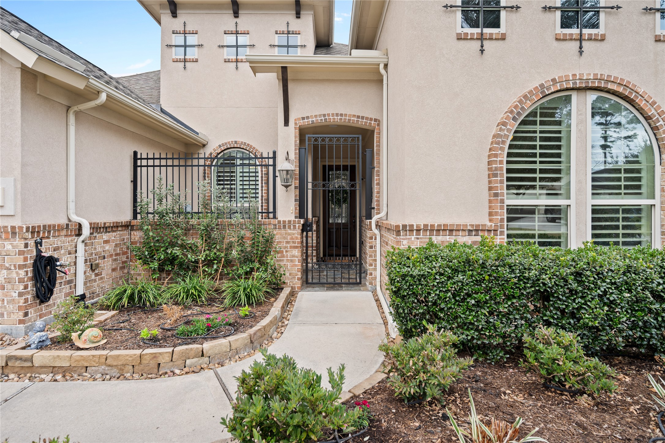19911 Cullen Ridge Drive Porter, TX 77365 - Photo 3 of 42 a front view of a house with garden