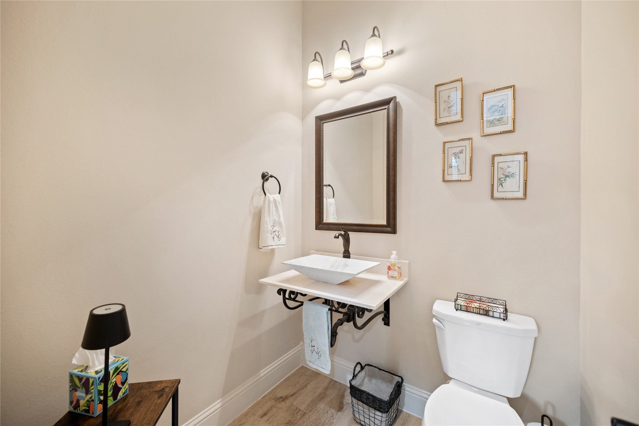19911 Cullen Ridge Drive Porter, TX 77365 - Photo 31 of 42 a bathroom with a toilet a sink and mirror