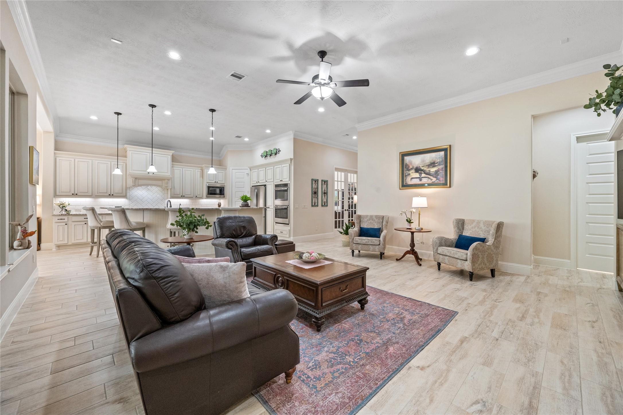 19911 Cullen Ridge Drive Porter, TX 77365 - Photo 8 of 42 a living room with furniture kitchen view and a chandelier