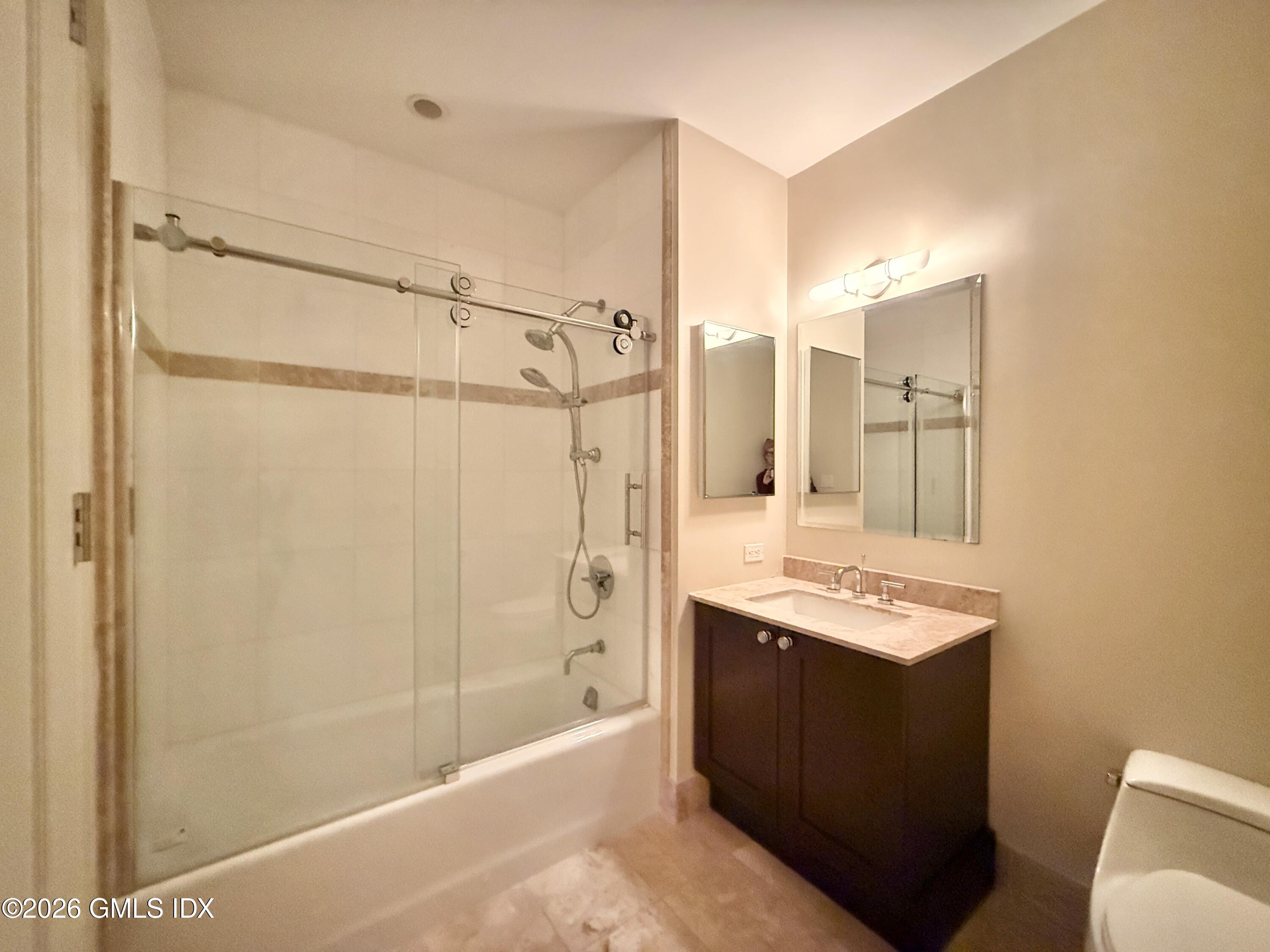 1 Broad Street, Unit PHD2 Stamford, CT 06901 - Photo 14 of 19 a bathroom with a shower mirror and a sink