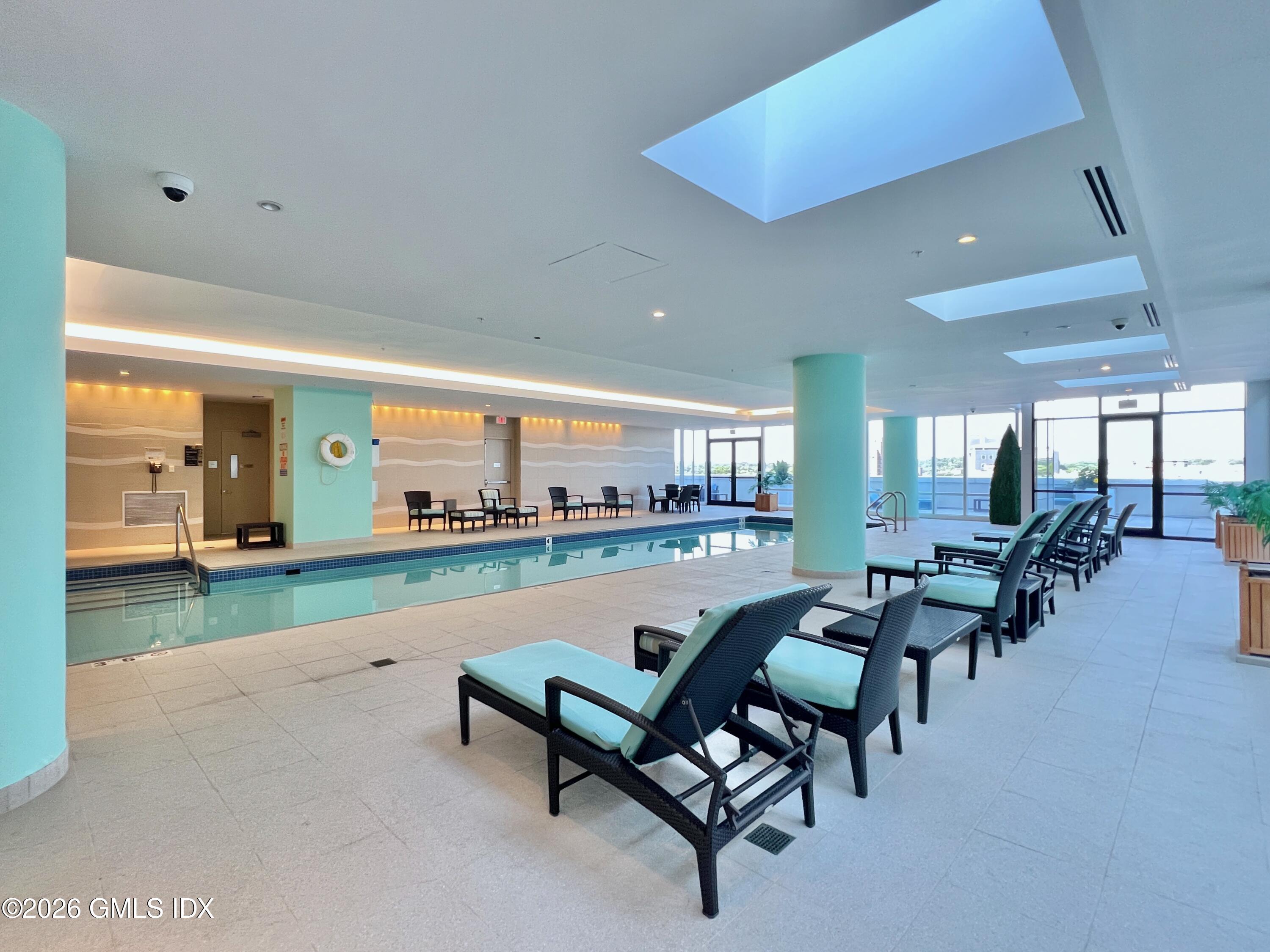 1 Broad Street, Unit PHD2 Stamford, CT 06901 - Photo 18 of 19 a living room with furniture and a table