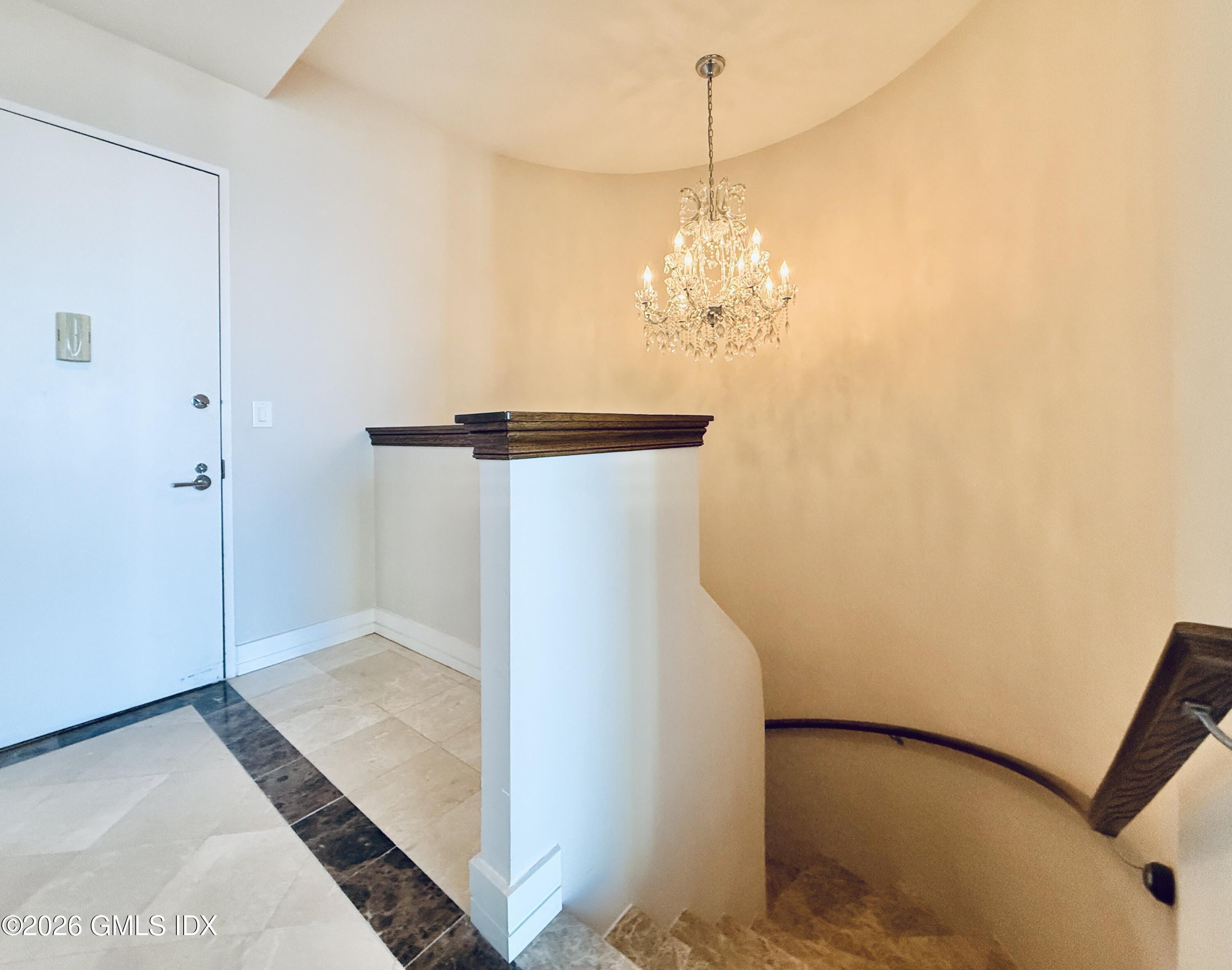 1 Broad Street, Unit PHD2 Stamford, CT 06901 - Photo 6 of 19 a view of a big room with chandelier fan and refrigerator