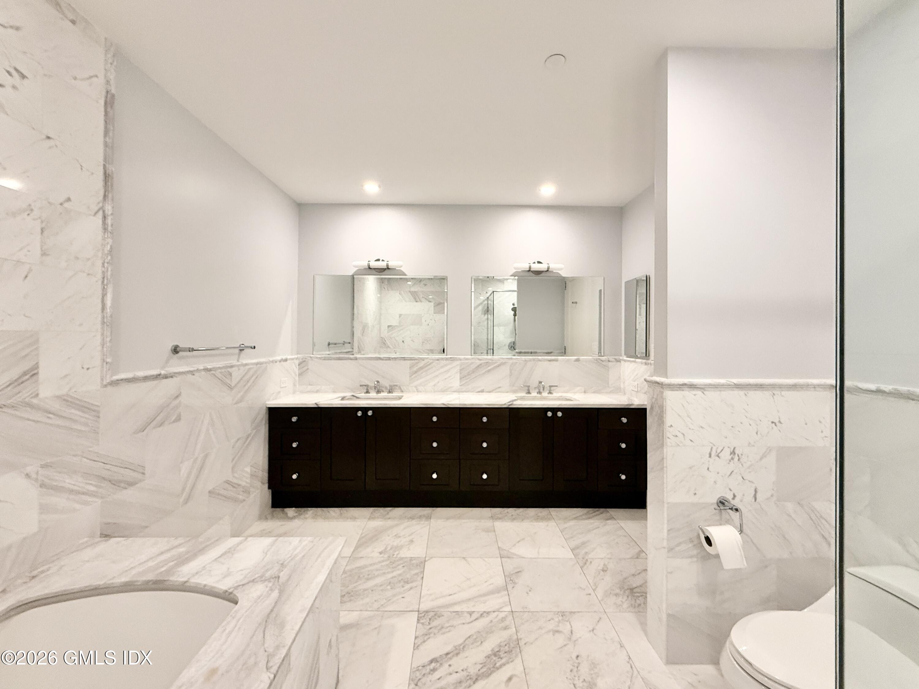 1 Broad Street, Unit PHD2 Stamford, CT 06901 - Photo 9 of 19 a bathroom with a bathtub double vanity and a sink