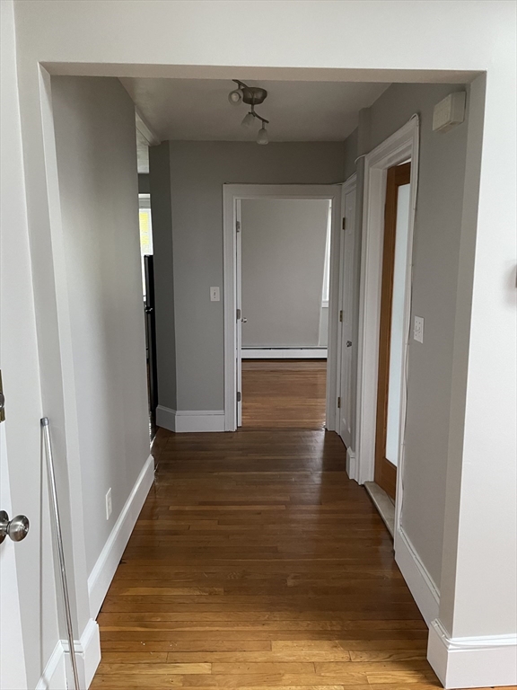 34 Herbert Street, Unit 6 Lynn, MA 01902 - Photo 8 of 9 a view of a hallway with wooden floor