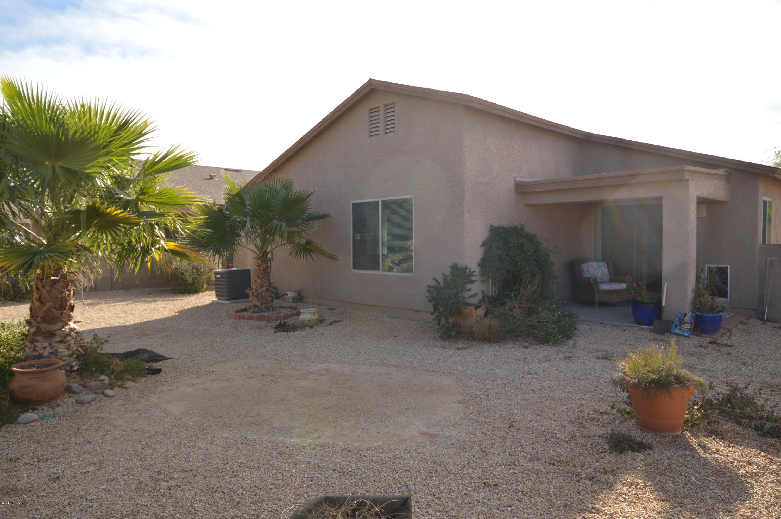 8396 West Benidorm Loop Tucson, AZ 85757 - Photo 12 of 13 a view of a house with backyard and sitting area