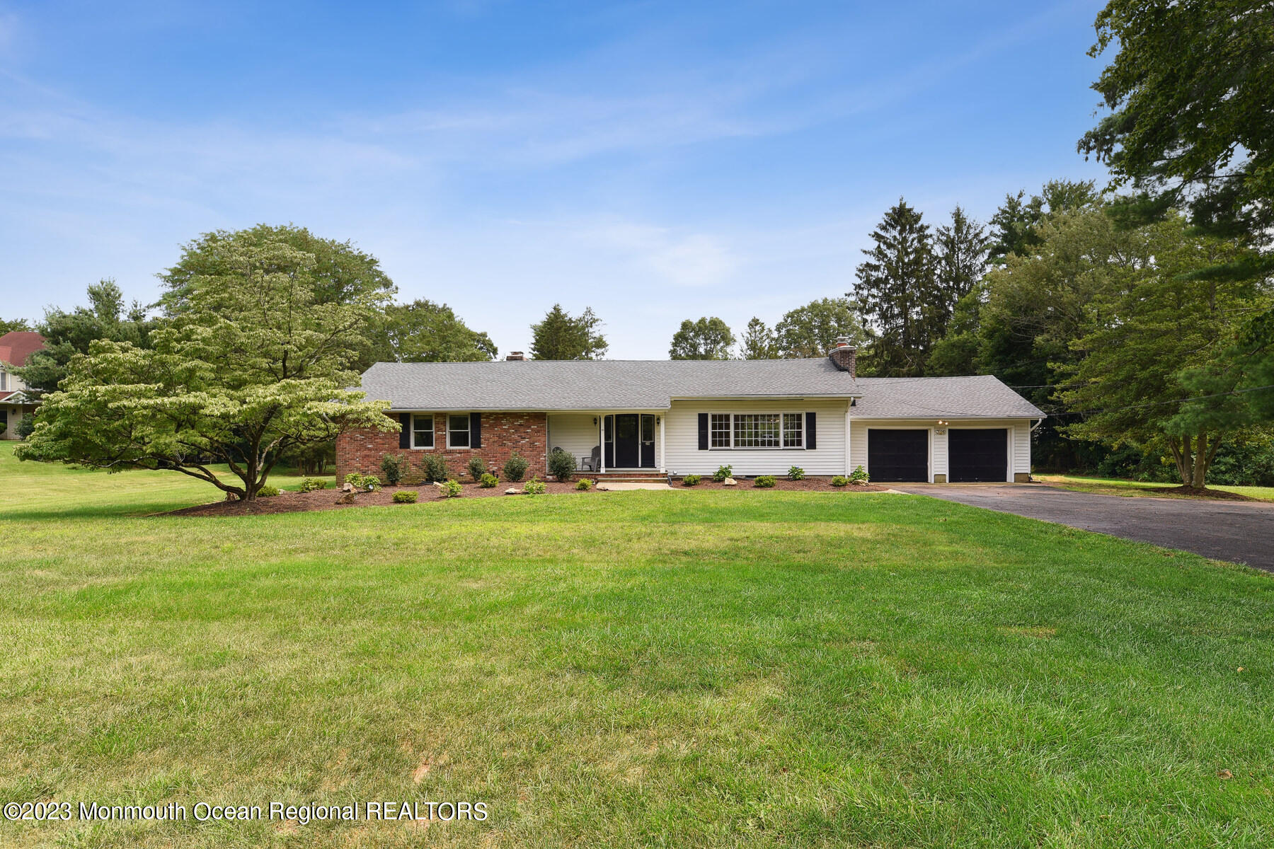 29 Willow Brook Road Holmdel, NJ 07733 - Photo 2 of 35 a front view of a house with garden