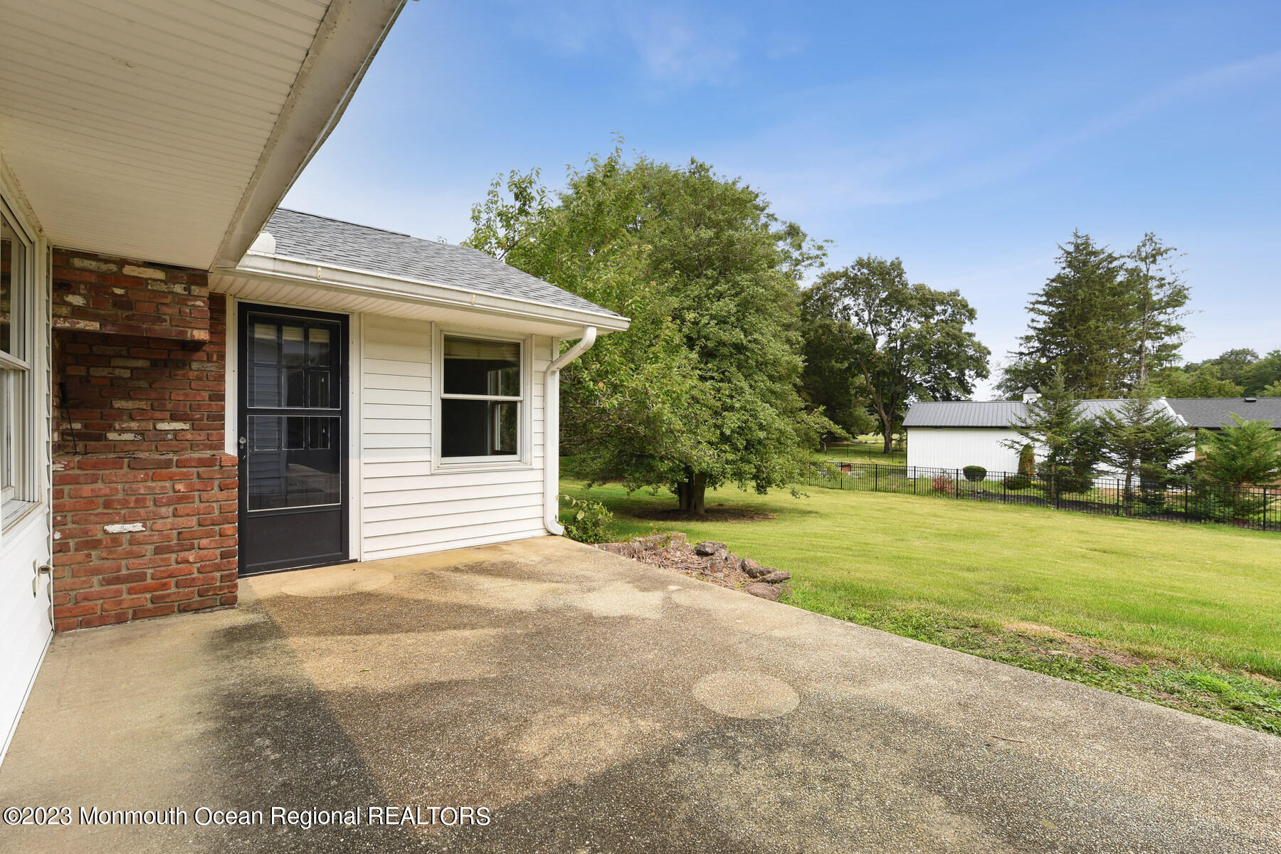 29 Willow Brook Road Holmdel, NJ 07733 - Photo 21 of 35 a view of a house with a yard and garage
