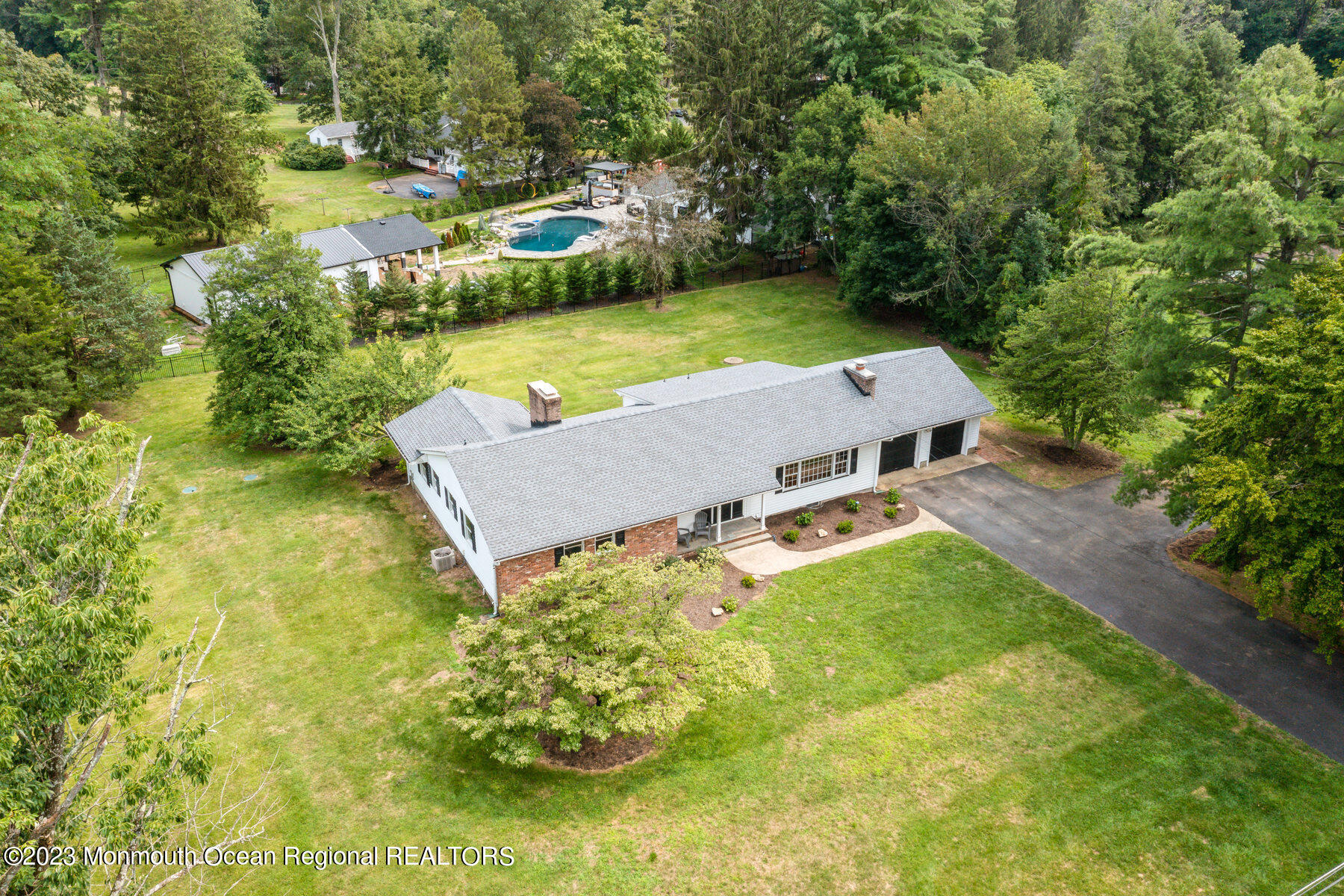 29 Willow Brook Road Holmdel, NJ 07733 - Photo 28 of 35 an aerial view of a house with swimming pool and garden view