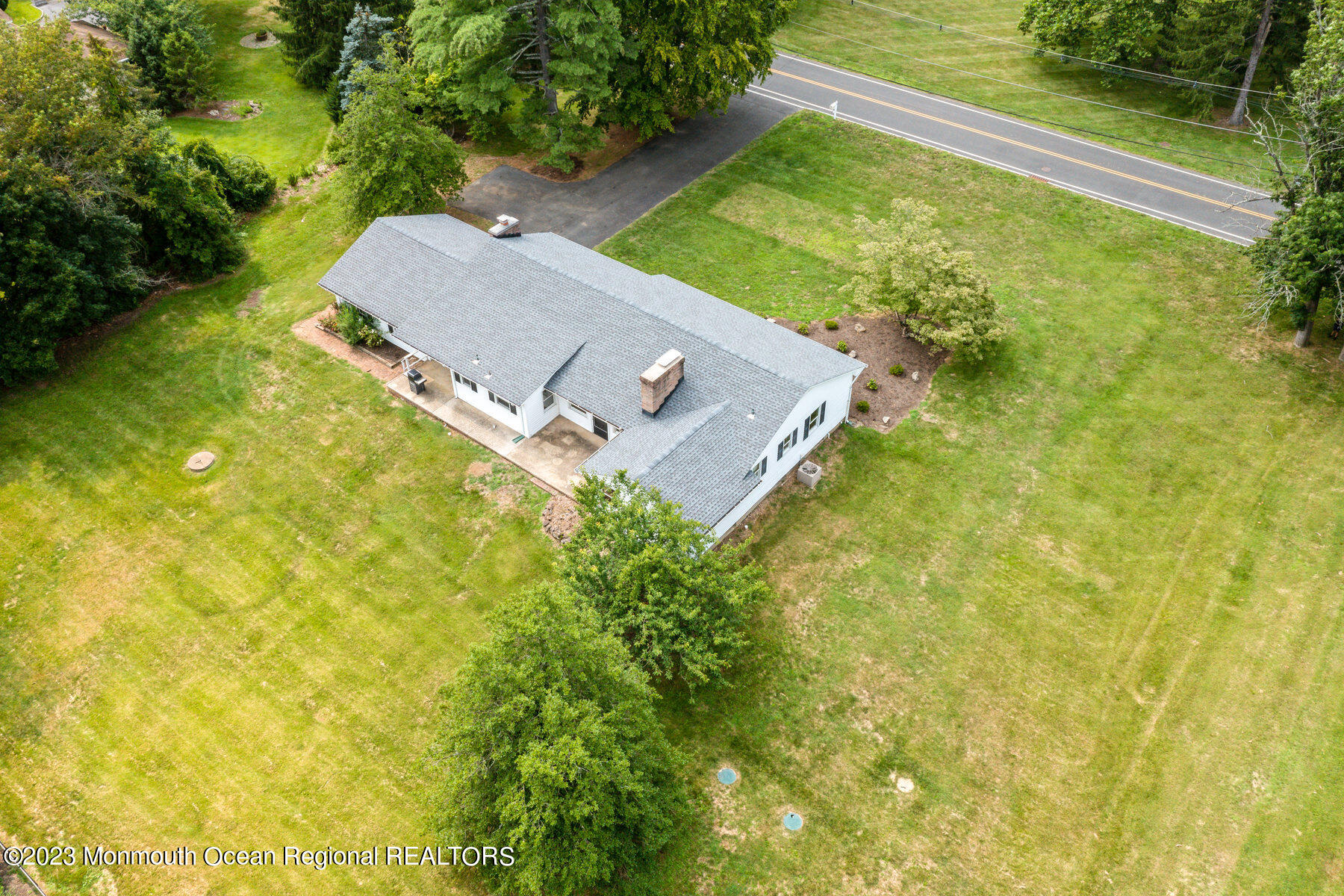 29 Willow Brook Road Holmdel, NJ 07733 - Photo 31 of 35 a view of a yard with a house