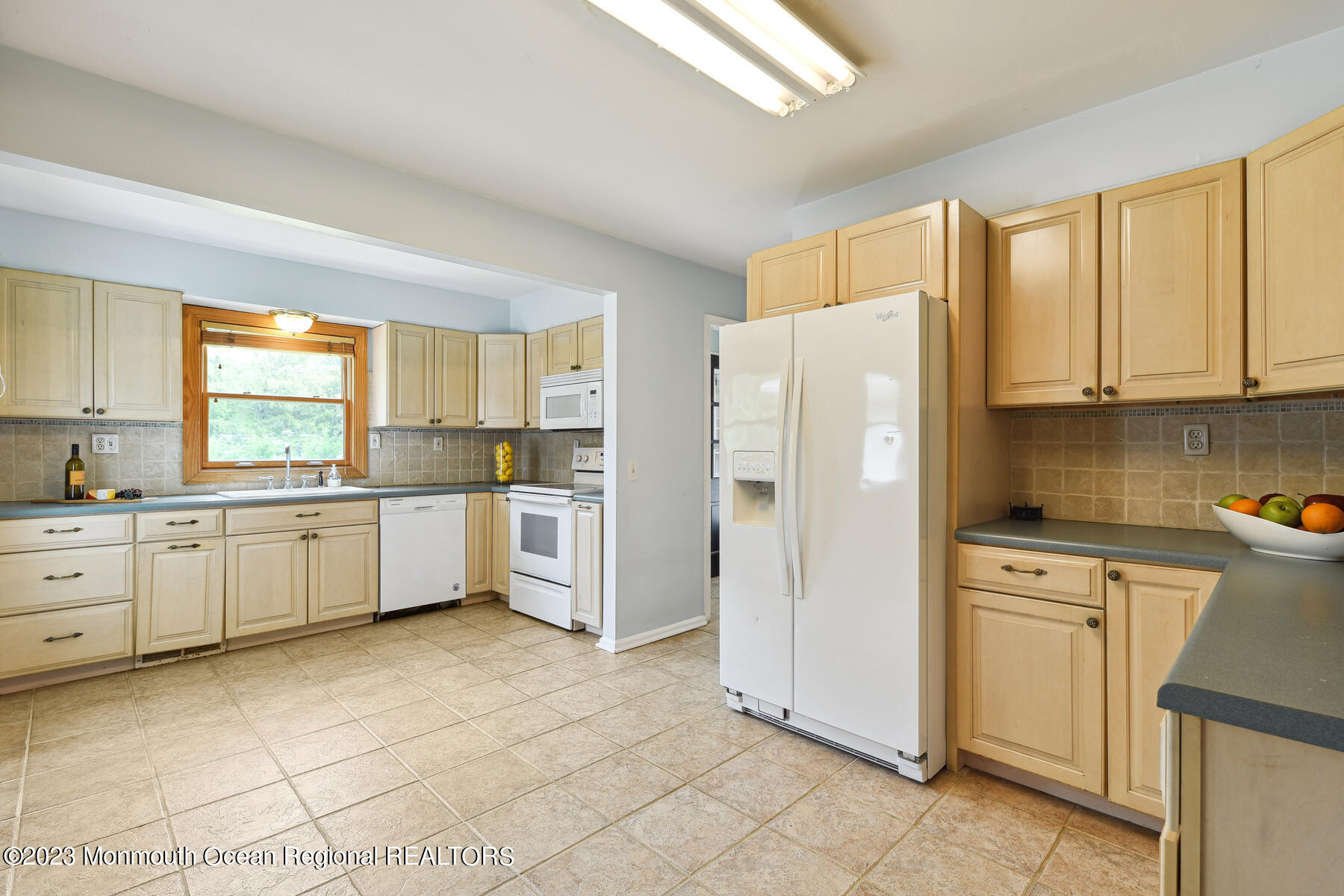 29 Willow Brook Road Holmdel, NJ 07733 - Photo 9 of 35 a kitchen with white cabinets and white appliances
