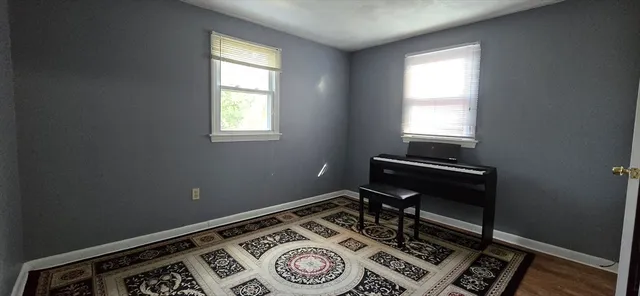 a room with chair and a window