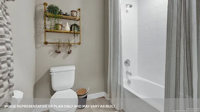 a view of a dining room with furniture a rug and wooden floor
