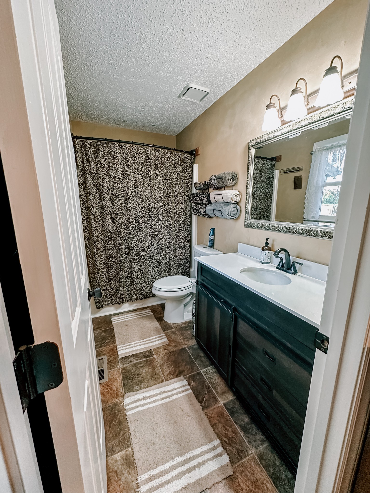 5124 East Calgary Murfreesboro, TN 37129 - Photo 11 of 32 a bathroom with a sink a toilet a mirror and shower