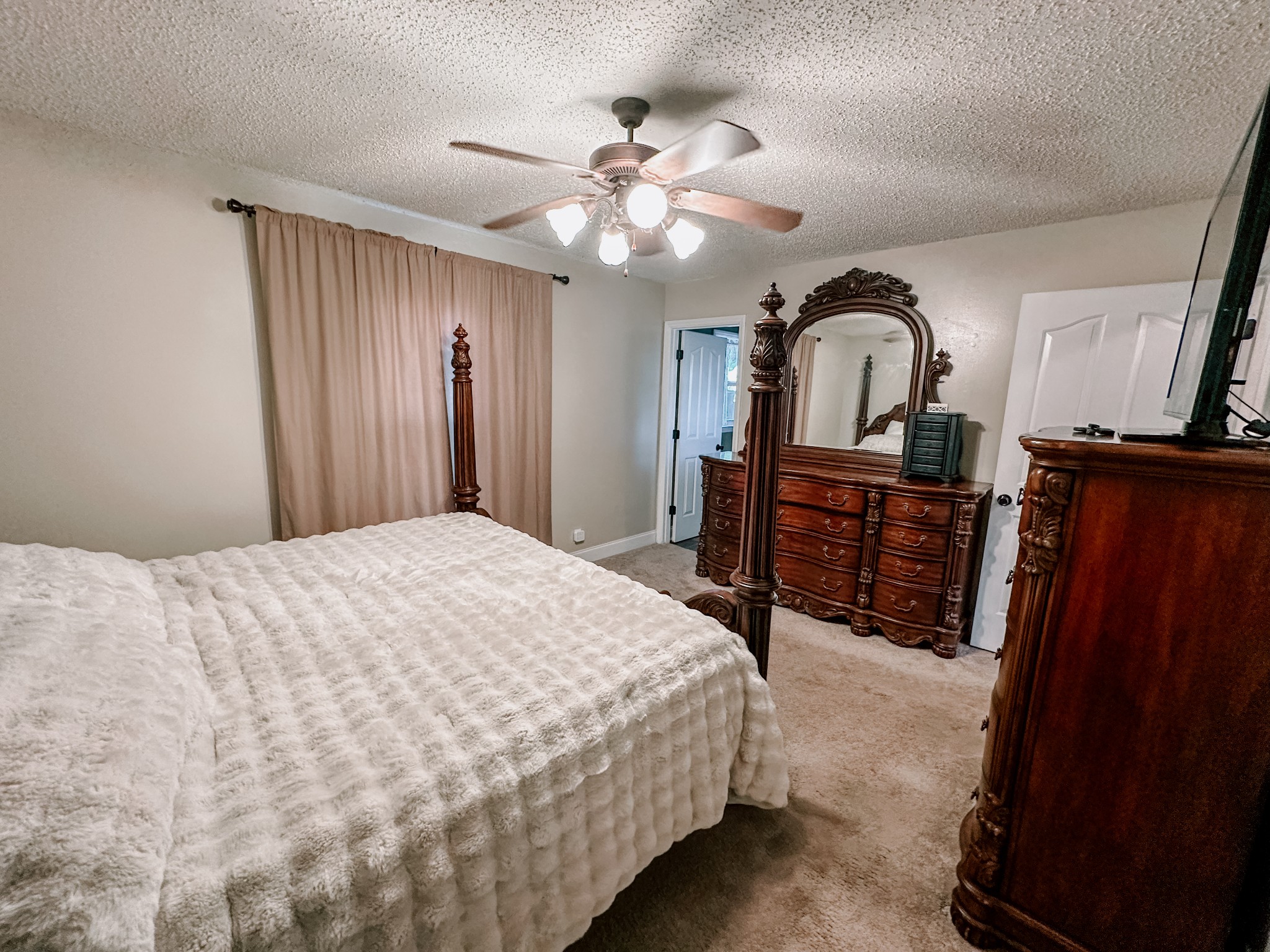 5124 East Calgary Murfreesboro, TN 37129 - Photo 13 of 32 a bedroom with a bed and a chandelier
