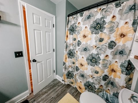 5124 East Calgary Murfreesboro, TN 37129 - Photo 17 of 32 a bathroom with a sink toilet and shower curtain