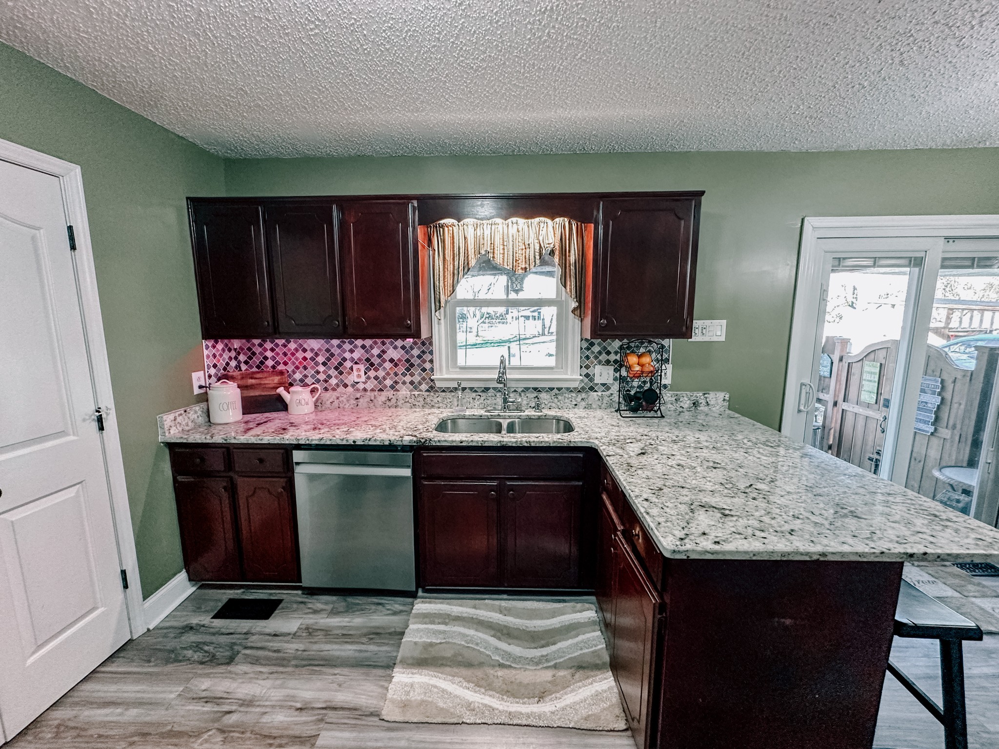 5124 East Calgary Murfreesboro, TN 37129 - Photo 5 of 32 a kitchen with granite countertop cabinets sink and window