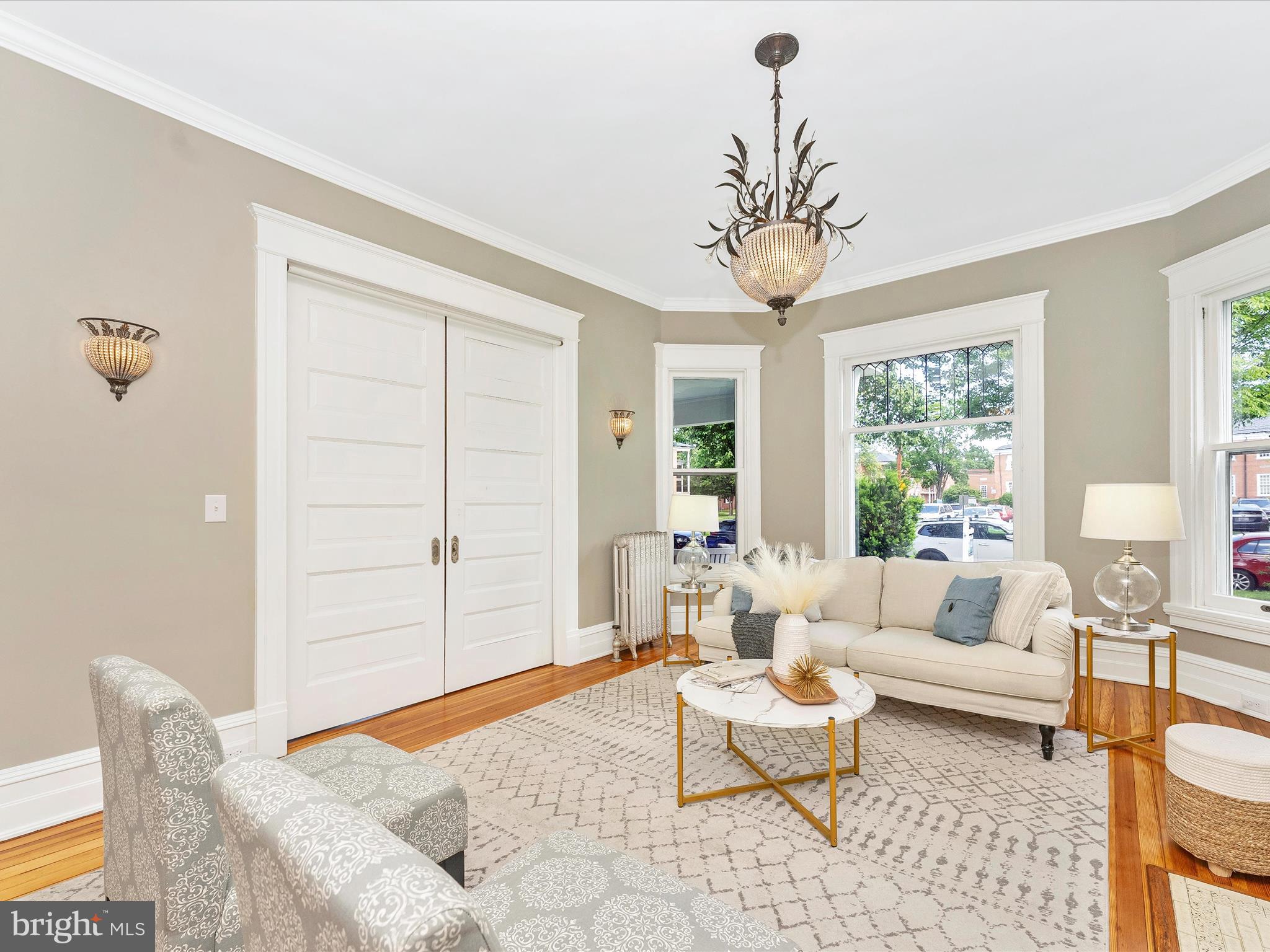 18 Clarke Place Frederick, MD 21701 - Photo 13 of 74 a living room with furniture a chandelier and a window