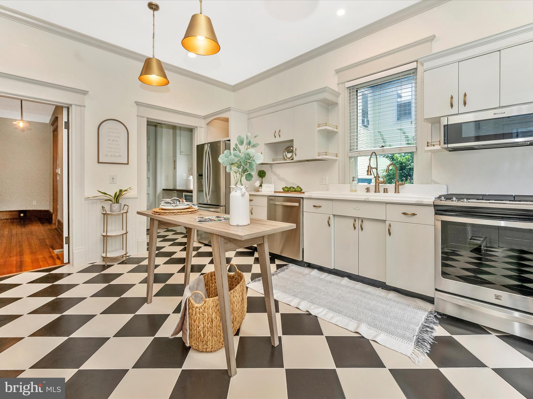 18 Clarke Place Frederick, MD 21701 - Photo 20 of 74 a kitchen with a checkered table and chairs
