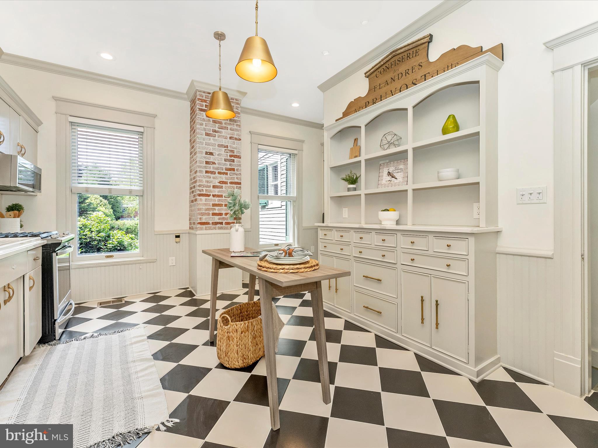 18 Clarke Place Frederick, MD 21701 - Photo 21 of 74 a kitchen with a checkered floor and white cabinets with wooden floor