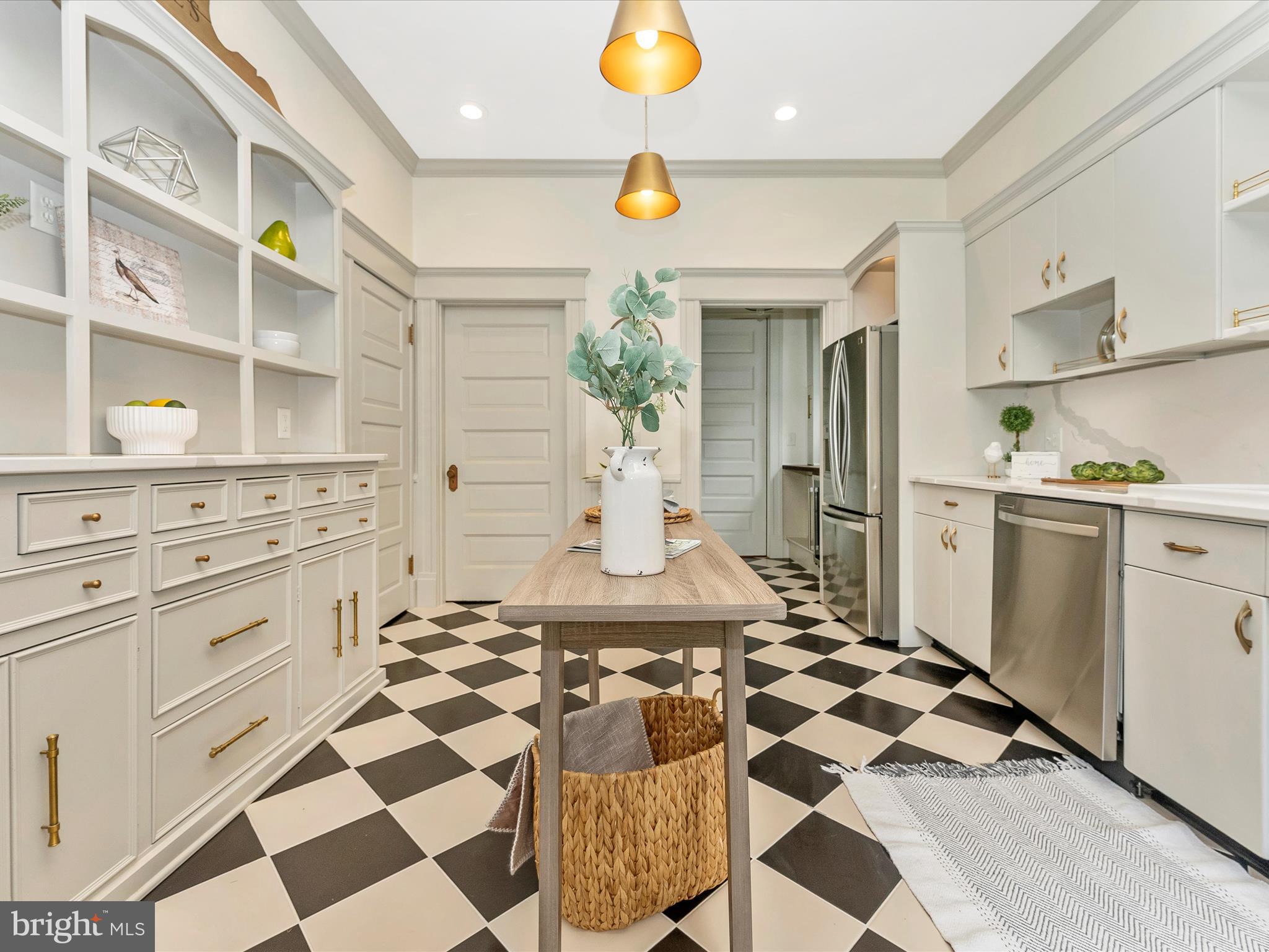 18 Clarke Place Frederick, MD 21701 - Photo 24 of 74 a kitchen with a checkered floor and white appliances