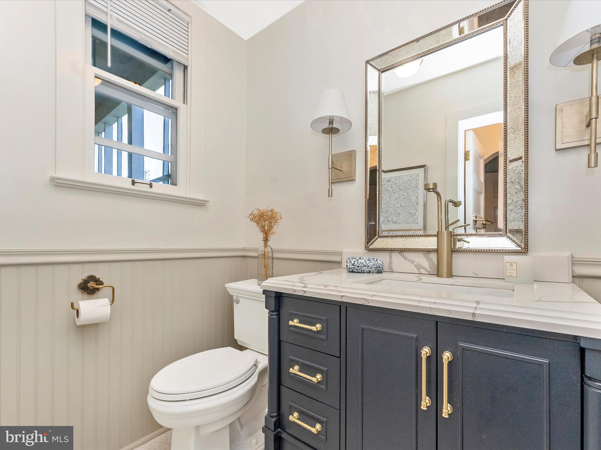 18 Clarke Place Frederick, MD 21701 - Photo 29 of 74 a bathroom with a granite countertop toilet sink and mirror