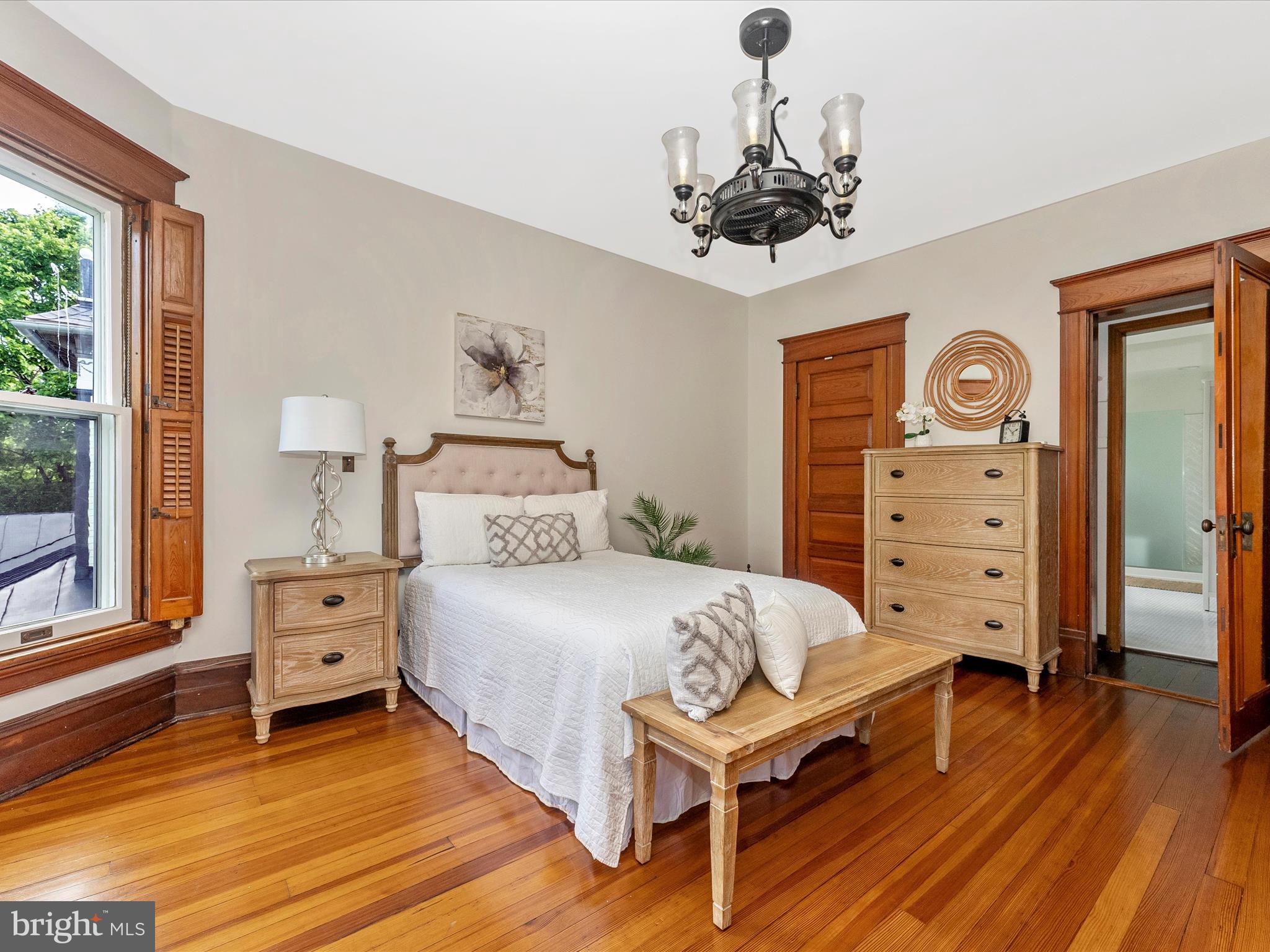 18 Clarke Place Frederick, MD 21701 - Photo 31 of 74 a bedroom with a bed and a chandelier