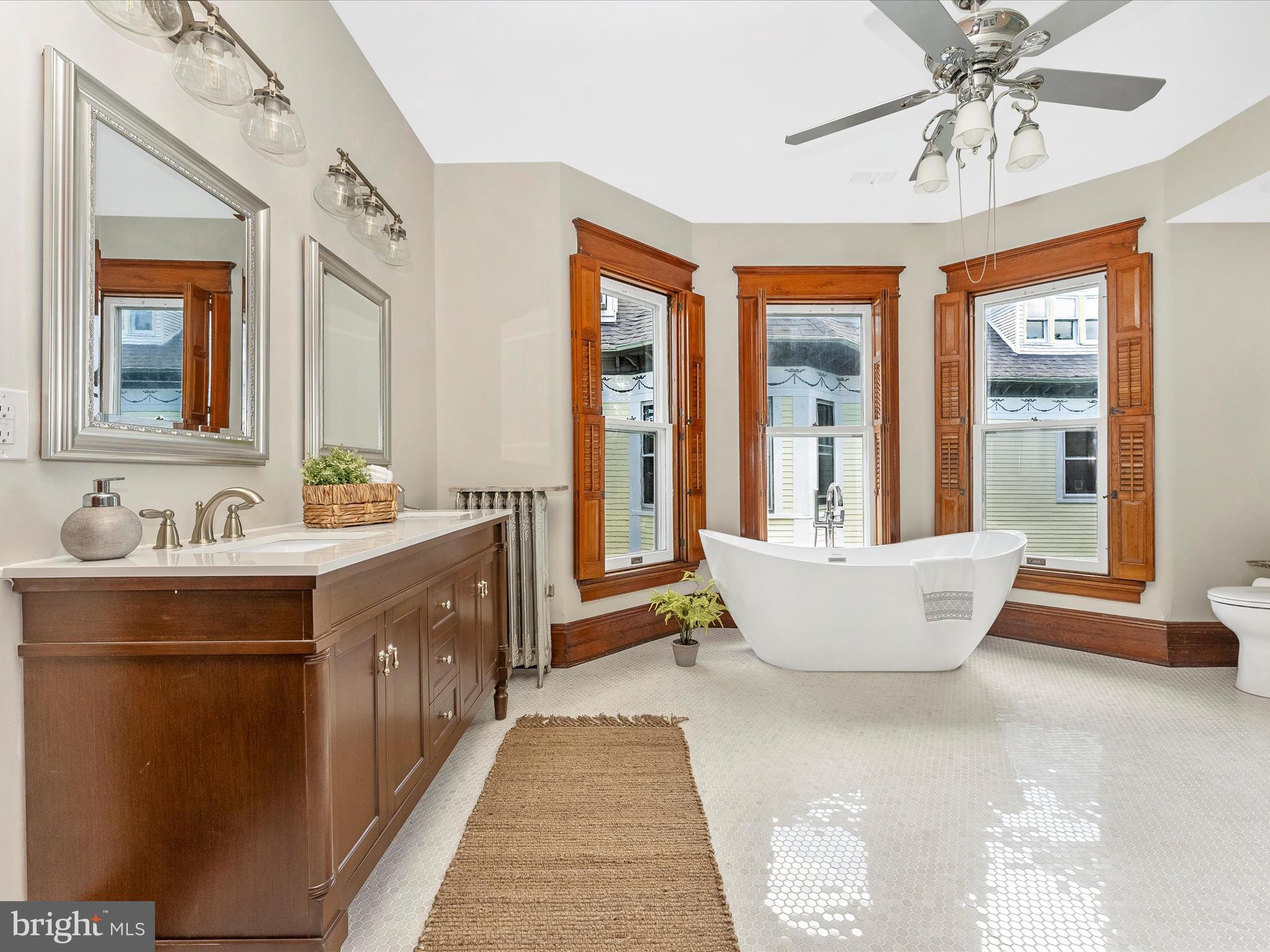 18 Clarke Place Frederick, MD 21701 - Photo 34 of 74 a spacious bathroom with a double vanity sink tub and a mirror