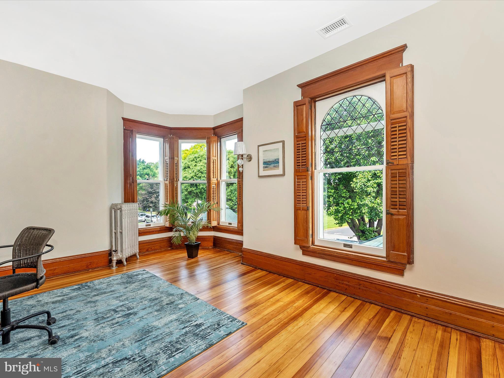 18 Clarke Place Frederick, MD 21701 - Photo 38 of 74 a view of an empty room with wooden floor and a window