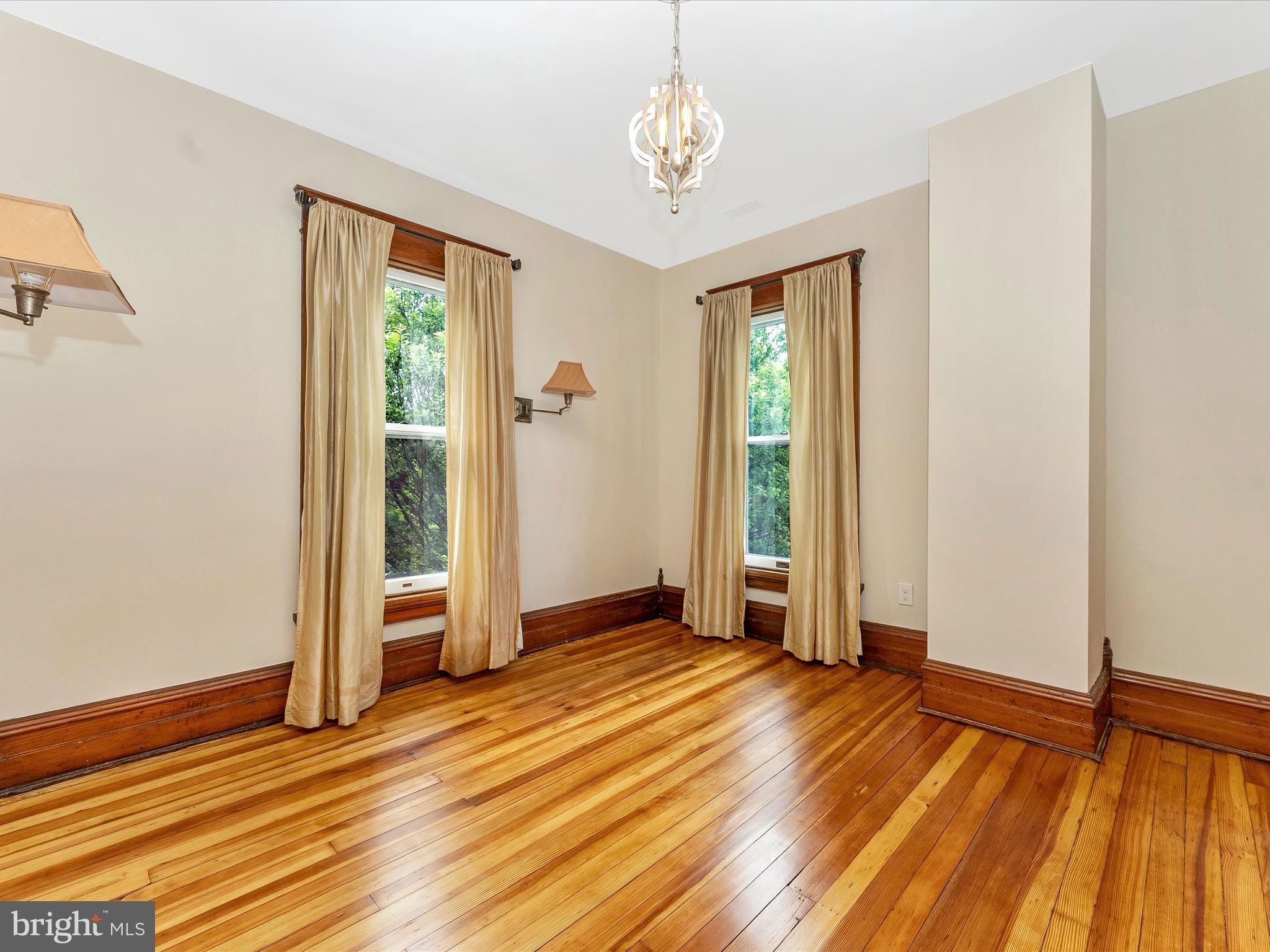 18 Clarke Place Frederick, MD 21701 - Photo 42 of 74 wooden floor in an empty room with a window