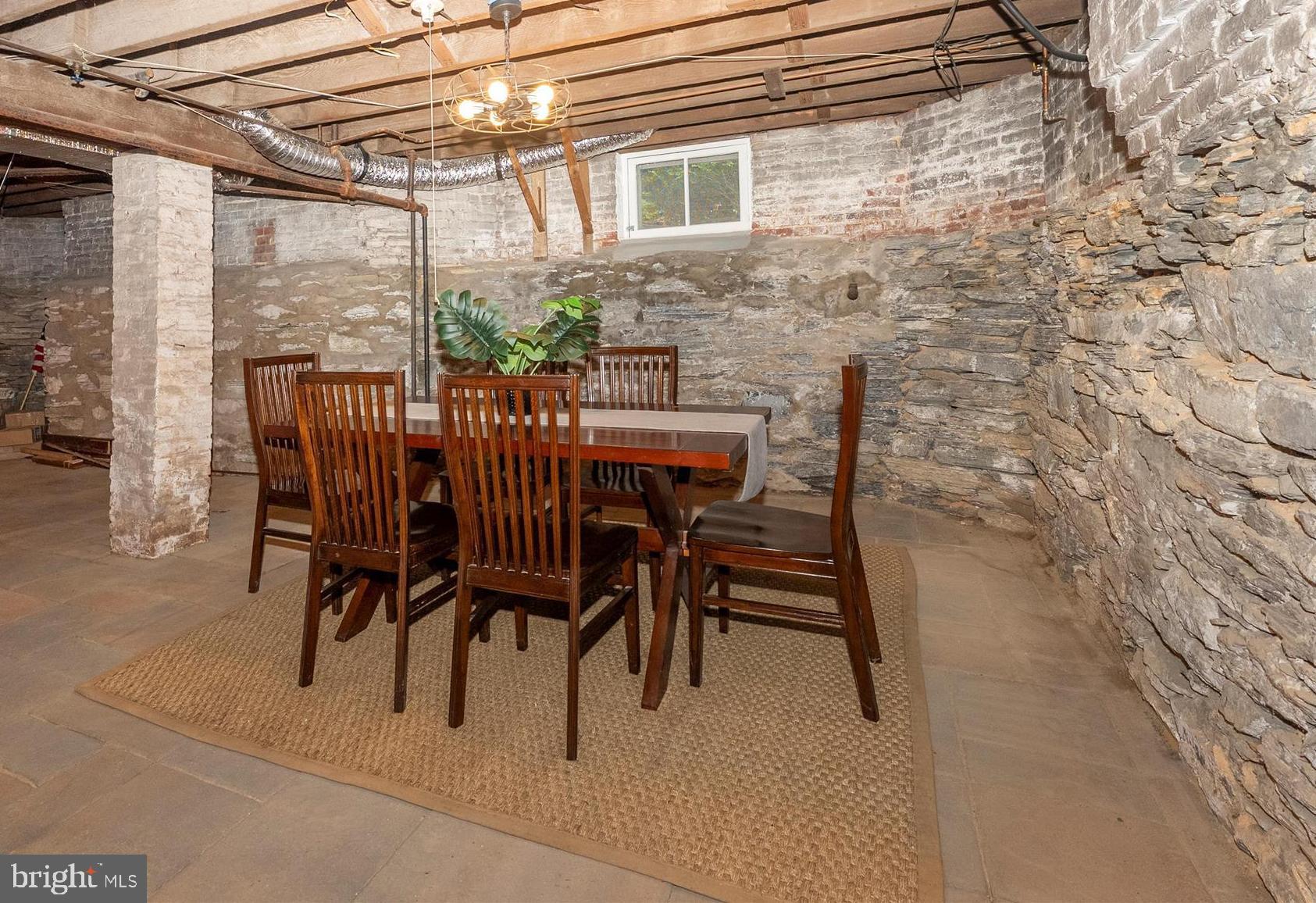 18 Clarke Place Frederick, MD 21701 - Photo 50 of 74 a patio with table and chairs and potted plants