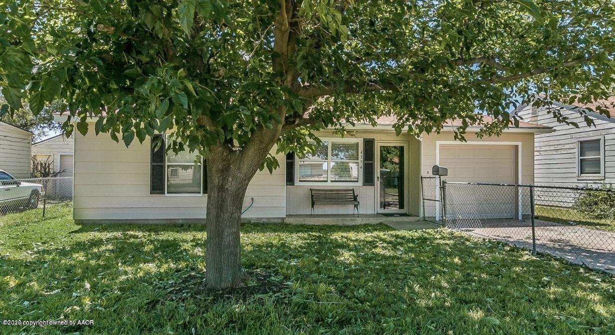 4354 South Polk Street Amarillo, TX 79110 - Photo 1 of 12 a house with trees in front of it