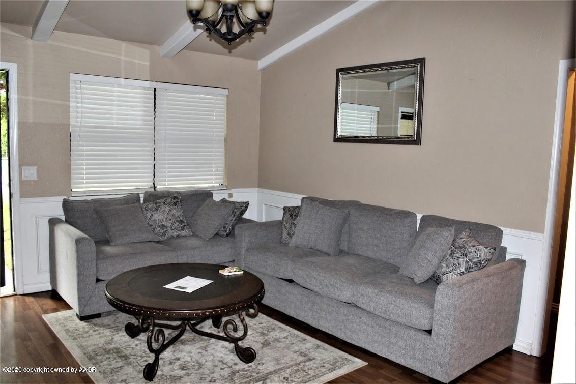 4354 South Polk Street Amarillo, TX 79110 - Photo 5 of 12 a living room with furniture and a hard wood floor